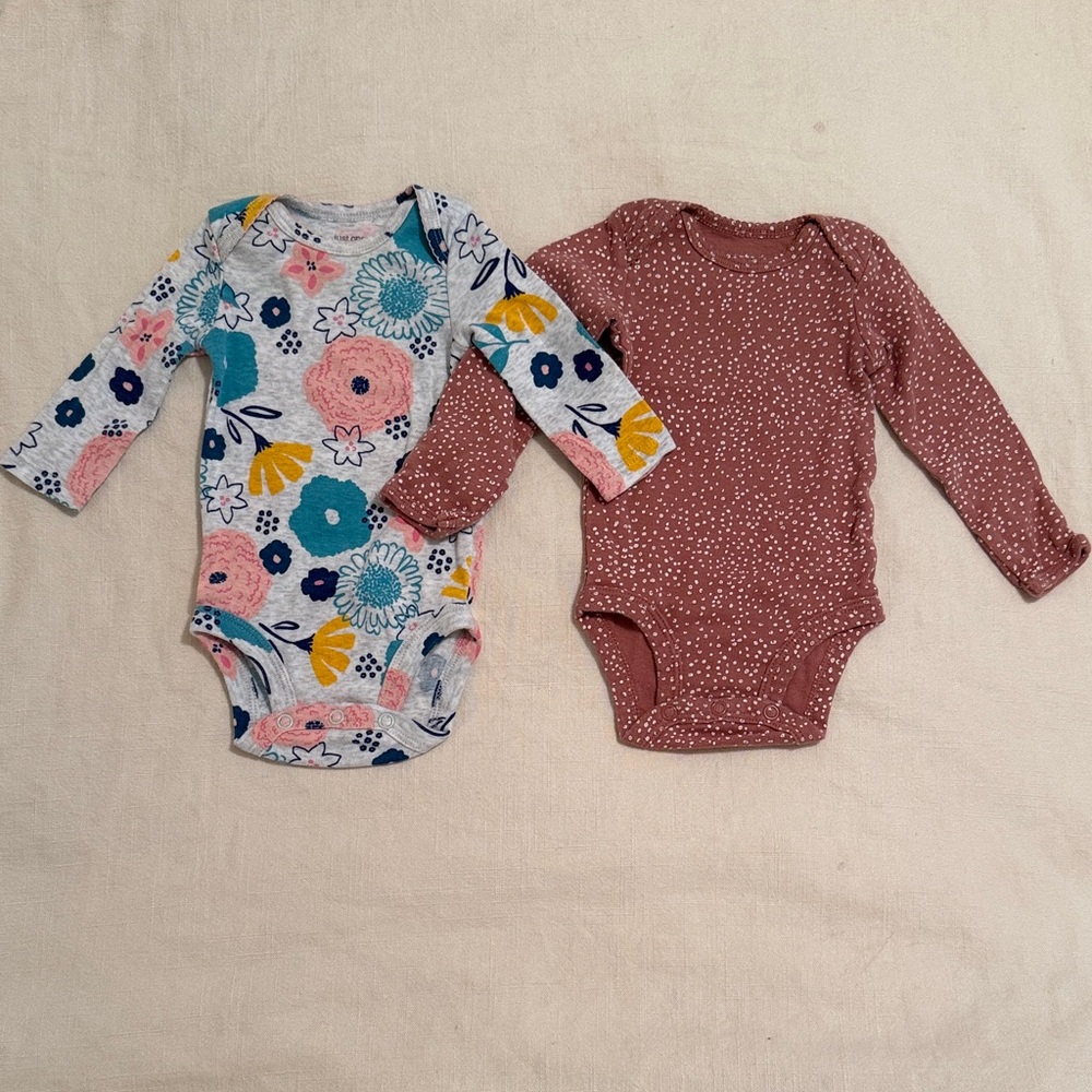 Pair of long sleeved Carter’s Bodysuits